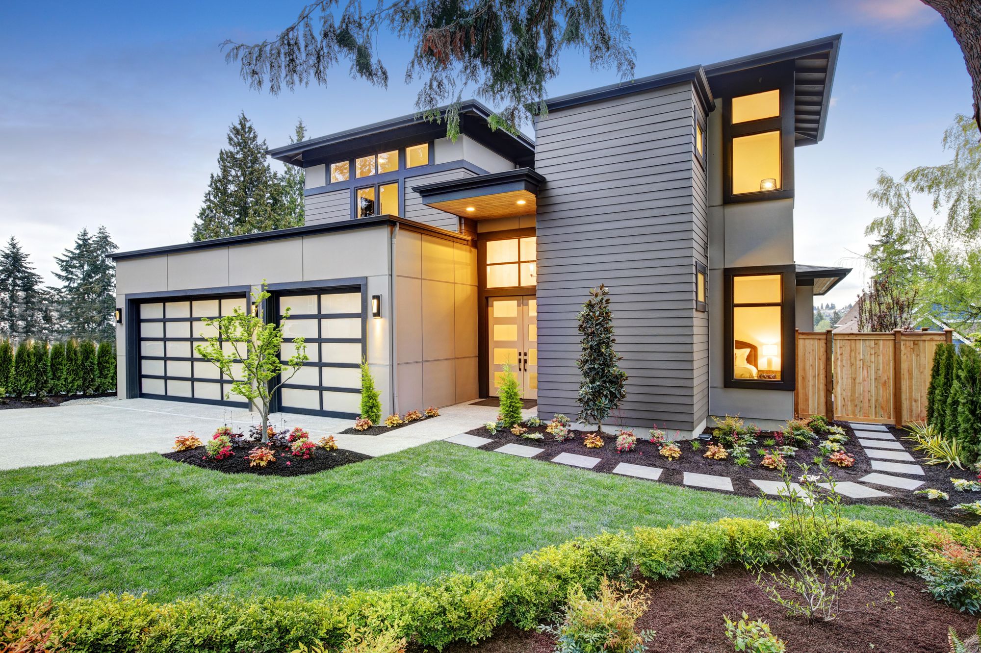 Modern west coast home at dusk in South Surrey