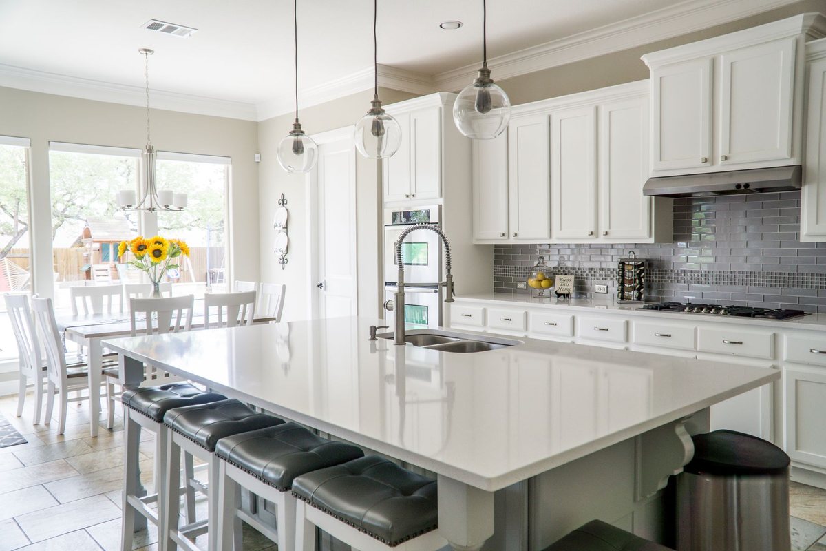 Bright family kitchen with large island — professional listing photography
